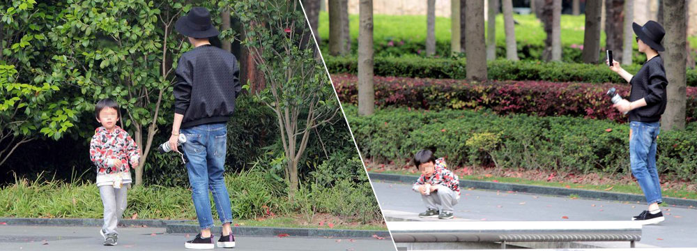 孙俪带儿子逛公园 举手机不停拍照 