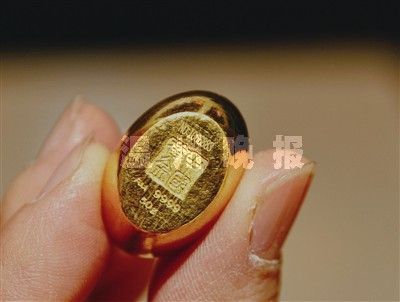 中国黄金9999金元宝。(图片来源:温州网)