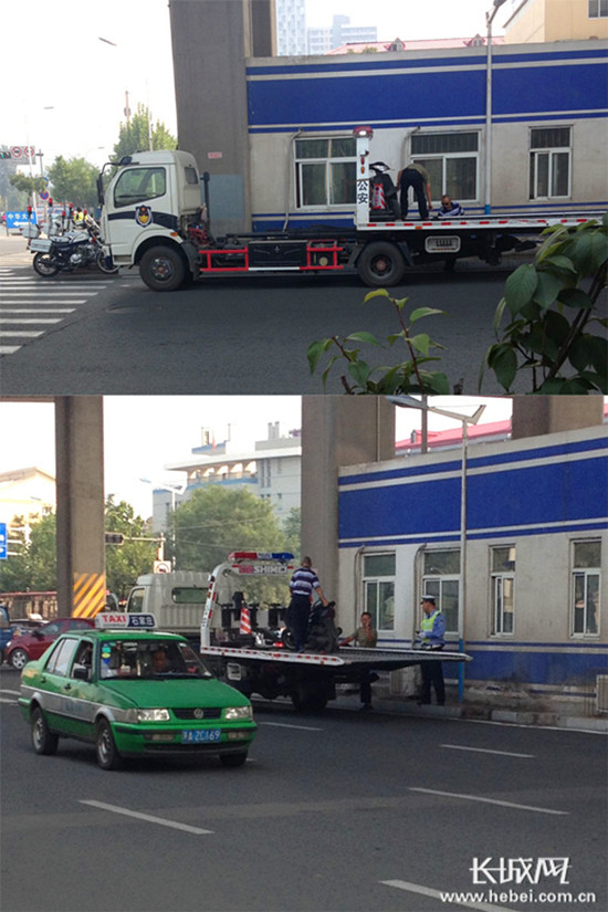 无牌警用拖车一路行驶至石家庄市交管局第六交通违法停车场.