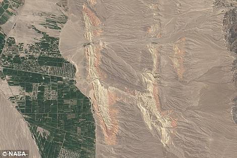 　　H：Landsat8卫星成像仪捕获的吉尔吉斯斯坦西南部的彩色山脉及河流↑