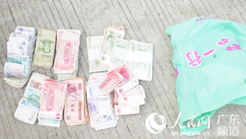 警方缴获的赃款。广州市公安局供图