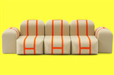 Matali Crasse 为意大利家具设计公司 Campeggi 设计了一款有单个模块系统组合的沙发(Self—made Seat)，并在 15 年米兰设计周上亮相。这沙发可以分开变成单个元素，每个坐垫模块都可以独立使用。远处看，它们像是用牛皮纸包裹并用橘色织物固定的泡沫。它实际上更像一个手提箱，通过橘色聚丙烯肩带可以轻易的伶起来移走。（实习编辑：周芝）