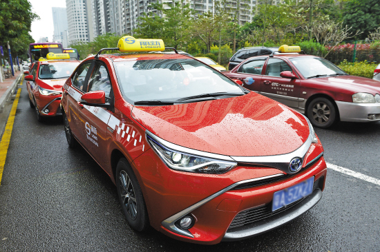 昨天,广州首批混合动力出租车,广汽丰田雷凌闪电橙上路 羊城晚报